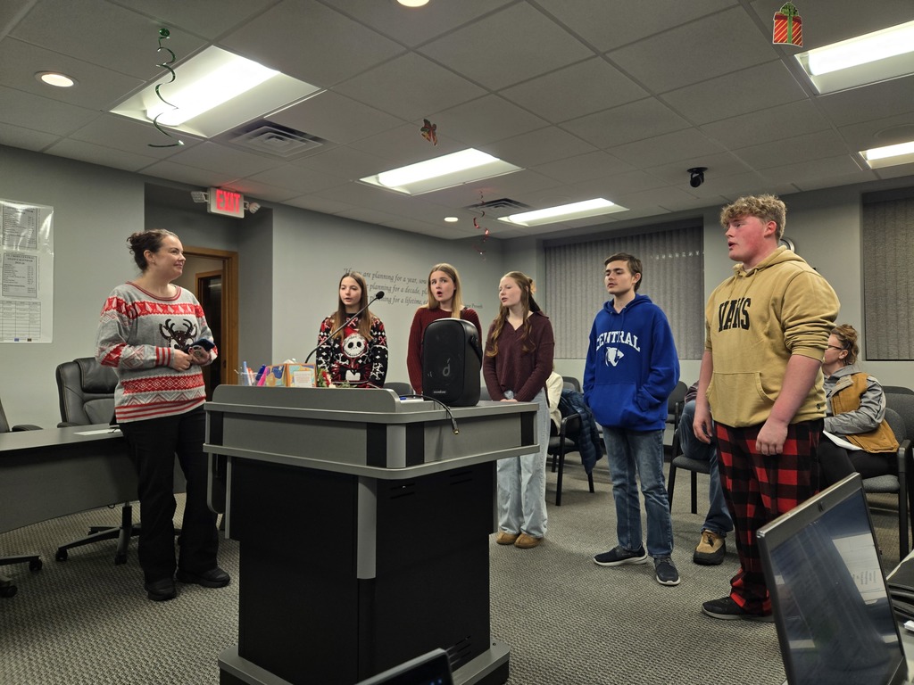 Cast members from Rudolph the Red Nosed Reindeer sing at the December 10th school board meeting