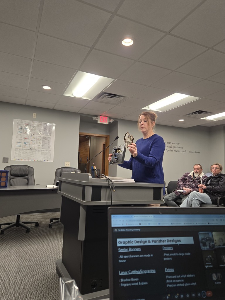 Graphic Design Teacher Amy Stevens highlights a couple of the products that will be available through Panther Designs