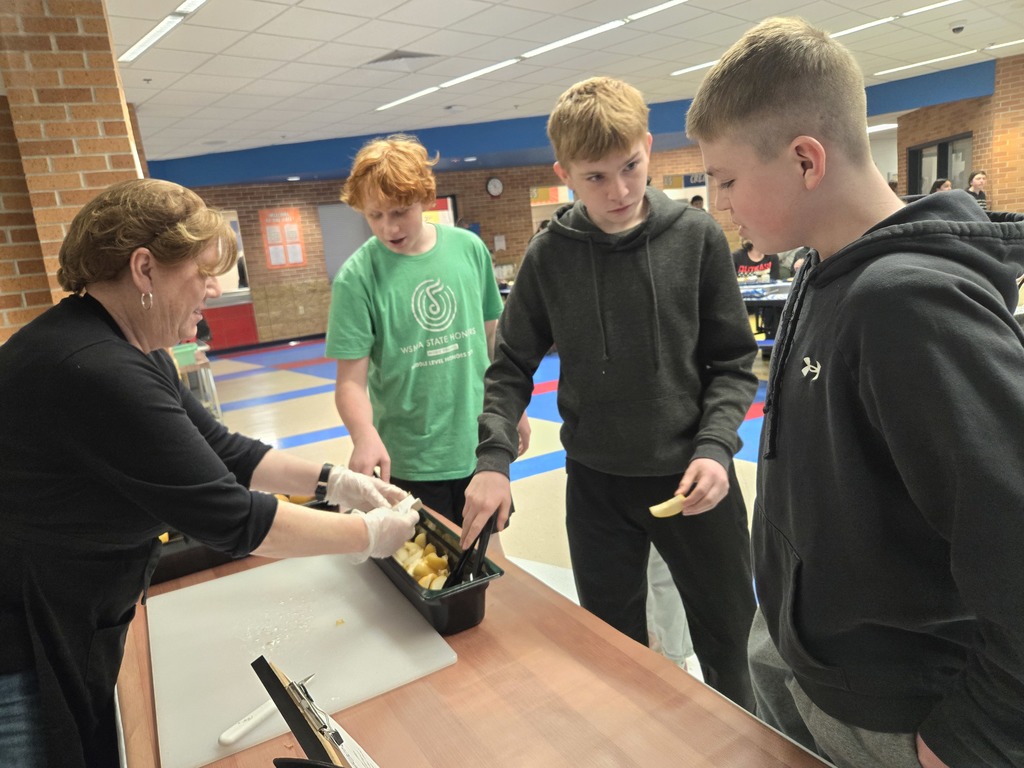 Middle school students tasting Apple Pears
