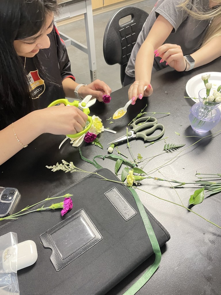 Basic Floral Design students learning about color and the basics of corsage and boutonniere construction
