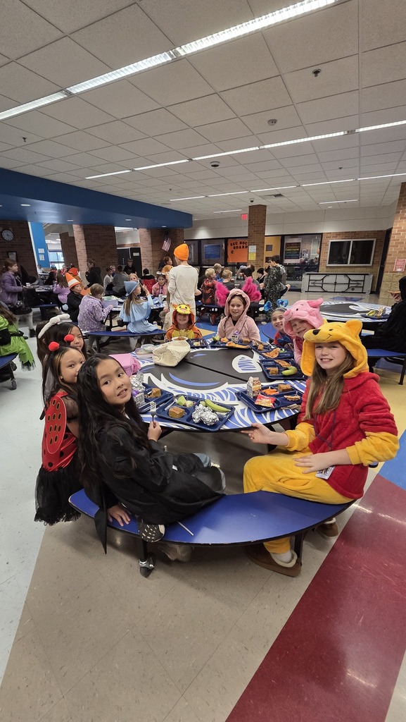 Middle school students dressed up for Halloween eating Ghoul-ash for lunch