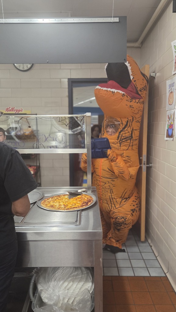 Middle School cook dressed up like dinosaur for lunch
