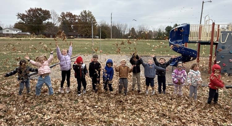 playing in the fall leaves outside