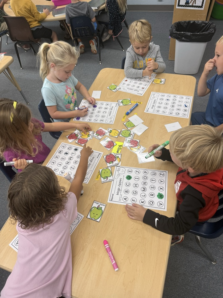 magic apples- we picked an apple, used a flashlight to shine on it and it would have a hidden letter then we would find that letter on on paper and use a paint dabber and mark it.