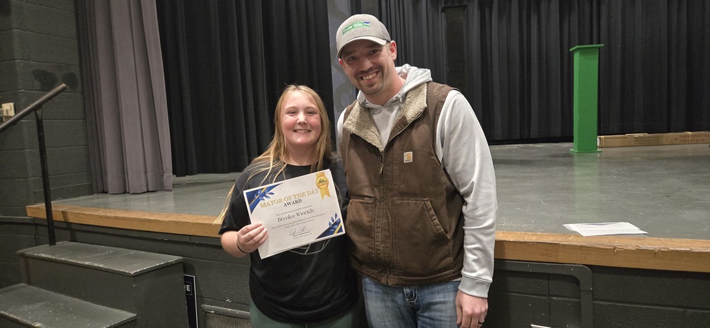 Brynlee - the winner of the Mayor for a Day and Mayor Whitehead posing for a photo
