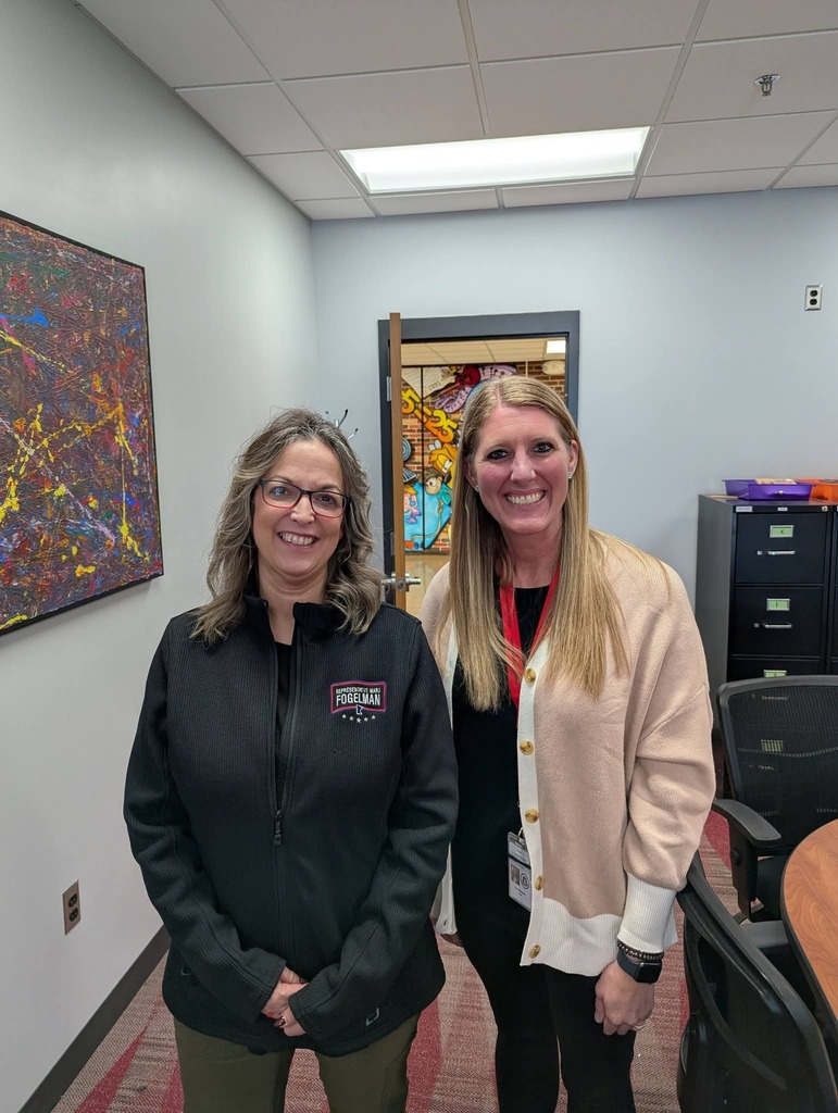 Representative Fogelman and Principal Murphy pose for a photo