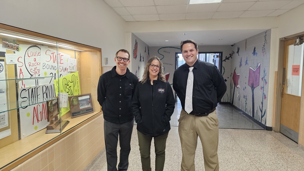 Principal Fugazzi, Representative Fogelman, and Superintendent Dawson pose for a phot