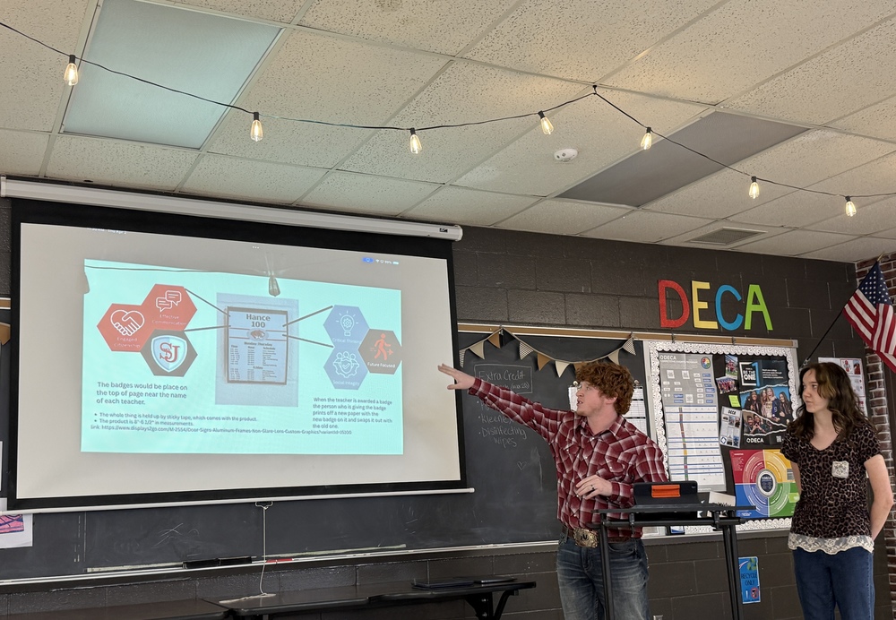 Student gives a presentation to district administrators. 