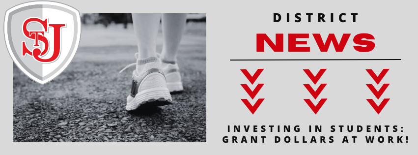 TEXT - District News; investing in students: grant dollars at work! image of sneakers on a person's feet walking on paved path. district shield logo with red stj. 