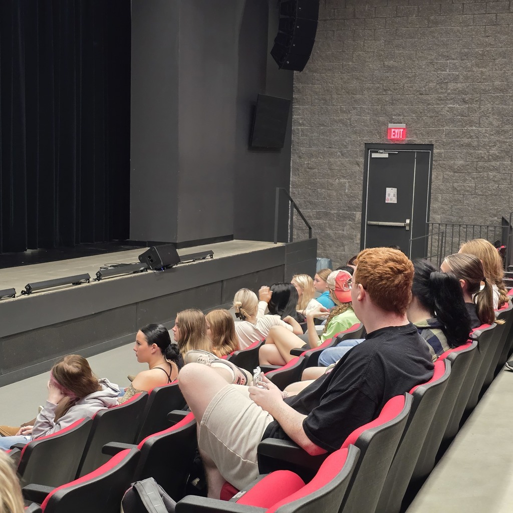Students listen to presentation. 