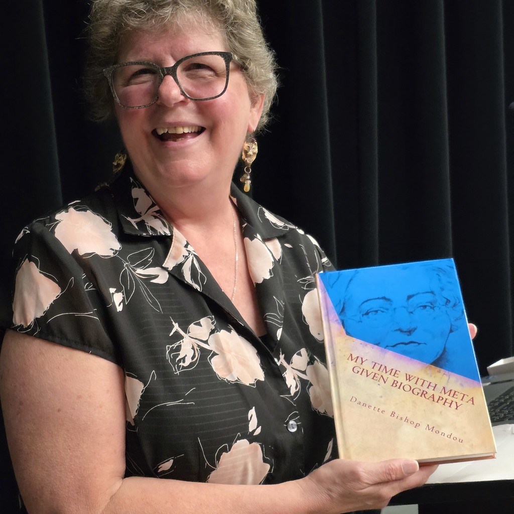 Author poses with her book. 