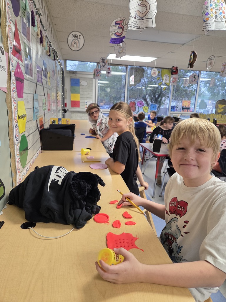 Third grade practices multiplication by creating arrays with play-dough.
