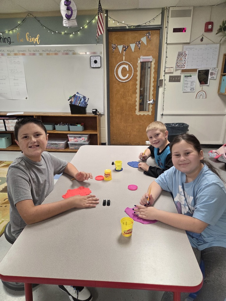 Third grade practices multiplication by creating arrays with play-dough.