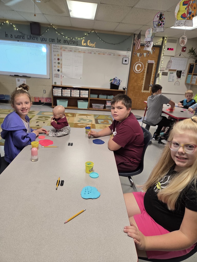 Third grade practices multiplication by creating arrays with play-dough.