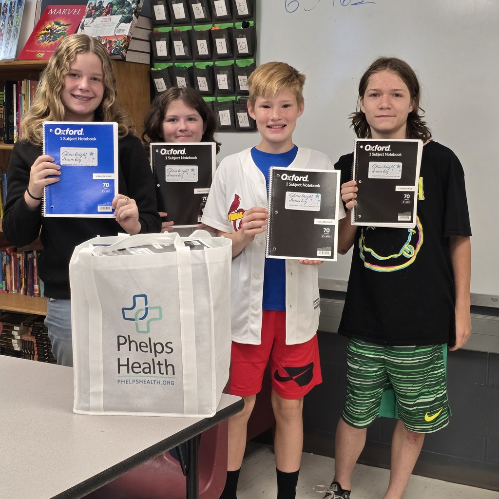 Students pose with notebooks that were donated by Phelps Health! 