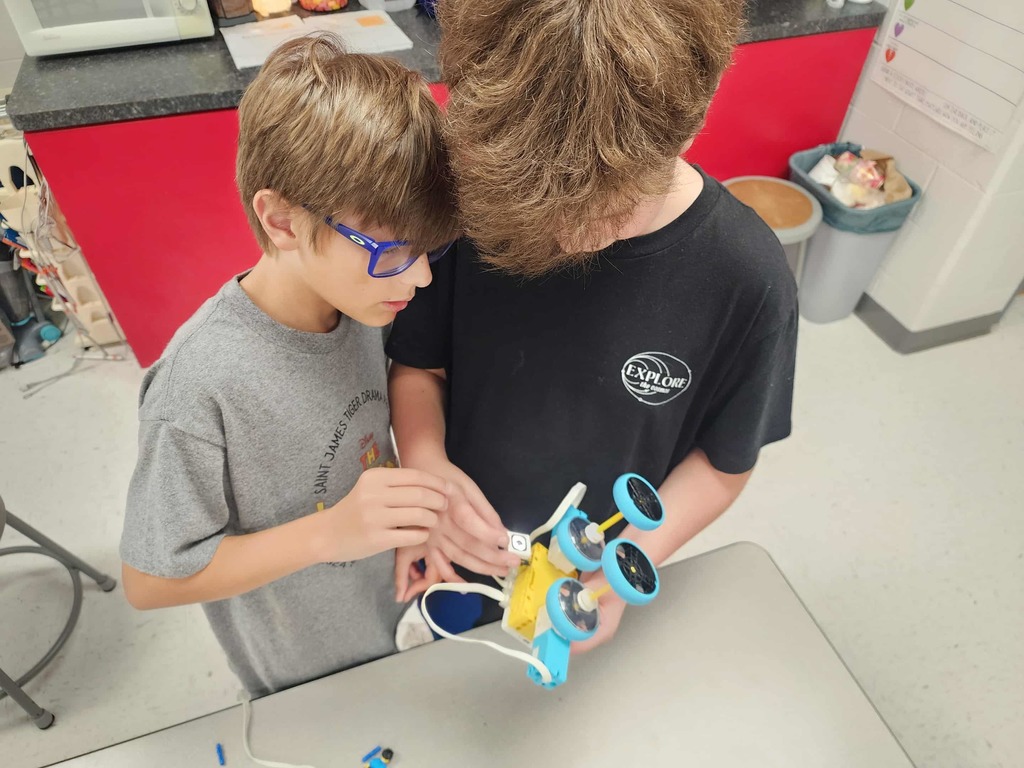 STEM Club at St. James Middle School has experimented with egg drop toss challenge, balloon cars, and robot car races. 