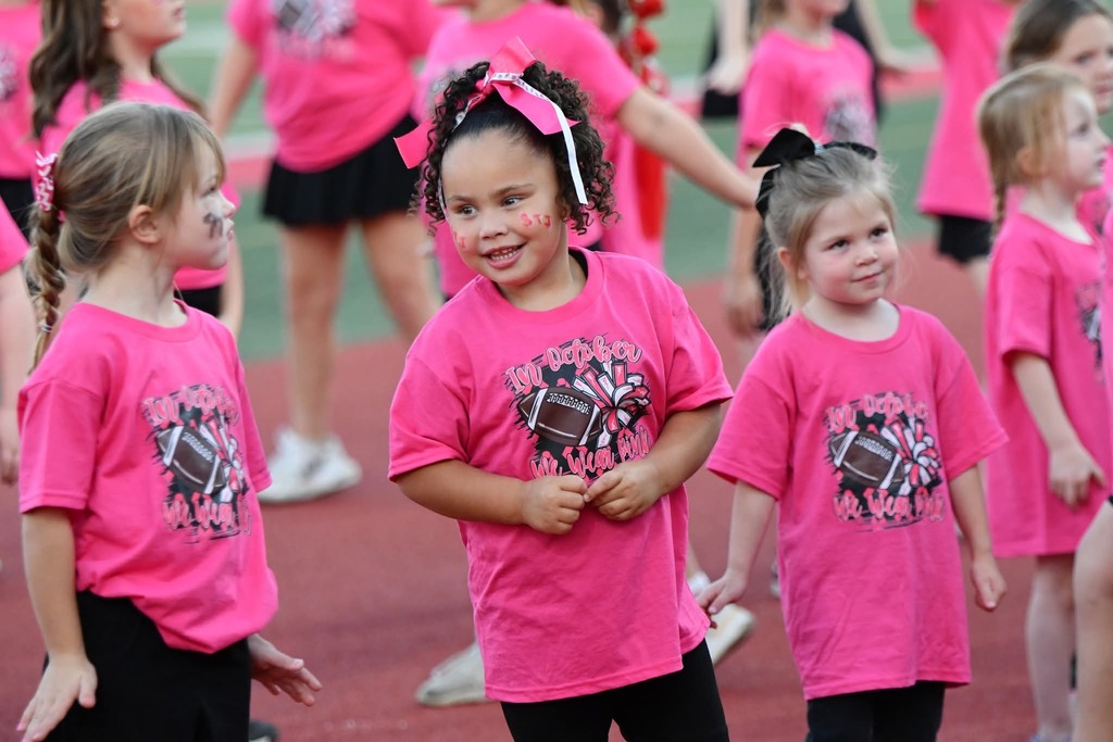 Pink Out Kiddy Camp performed before the varsity football camp on Friday night. 