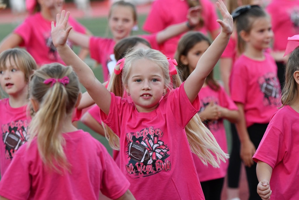 Pink Out Kiddy Camp performed before the varsity football camp on Friday night. 