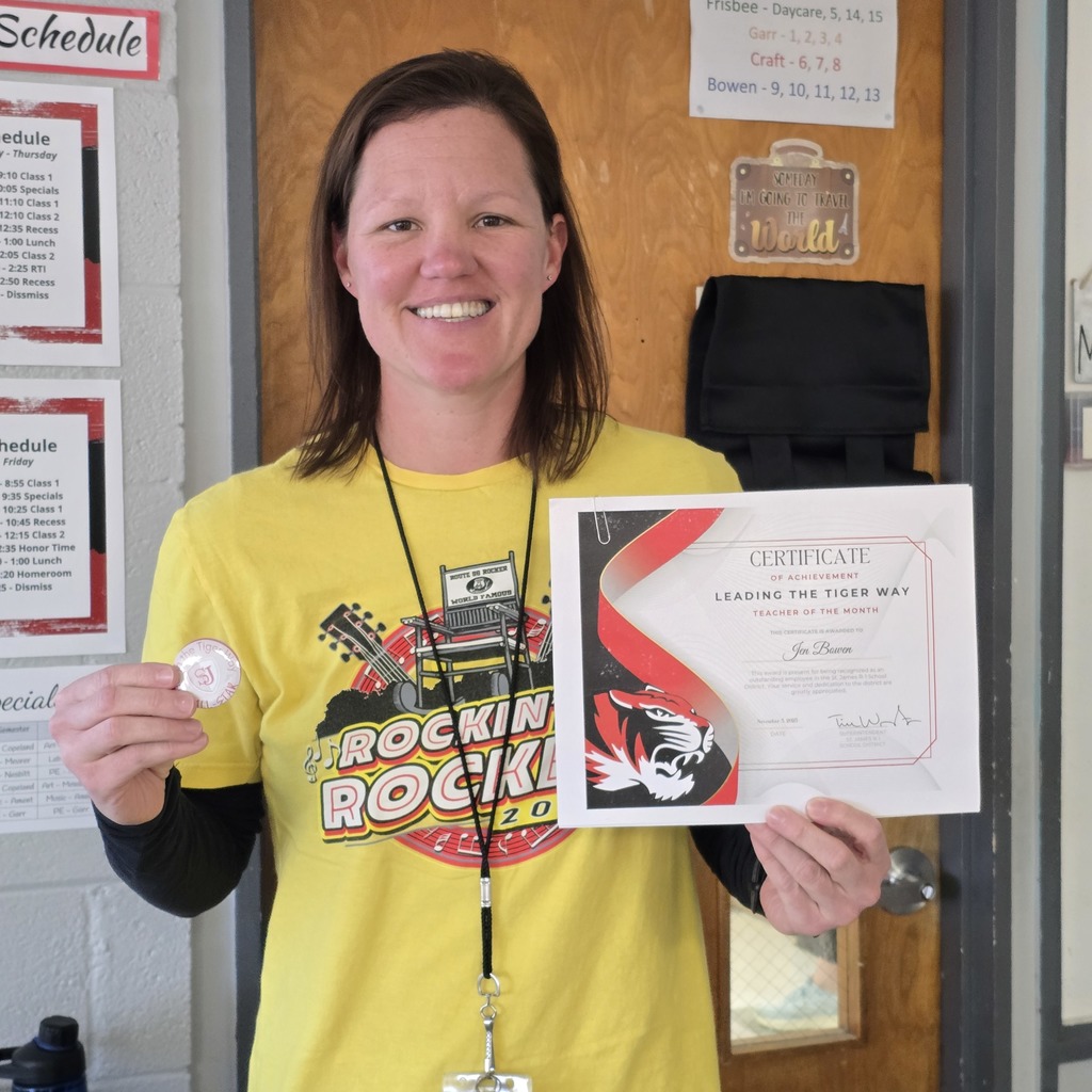 October Leading the Tiger Way winner is presented with their certificate. 