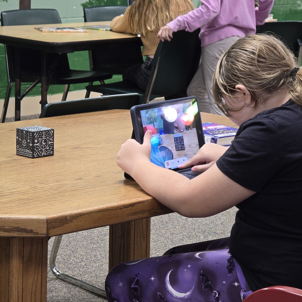 3rd grade students use Merge Cubes in the library to explore the human body for their science unit. 