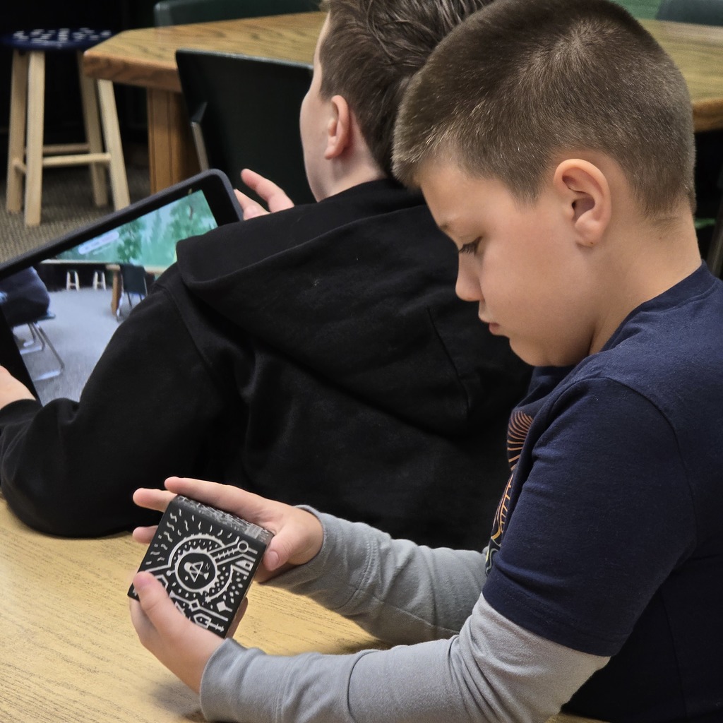 3rd grade students use Merge Cubes in the library to explore the human body for their science unit. 