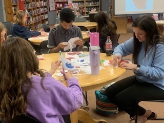 Students work on their Cubism art project.