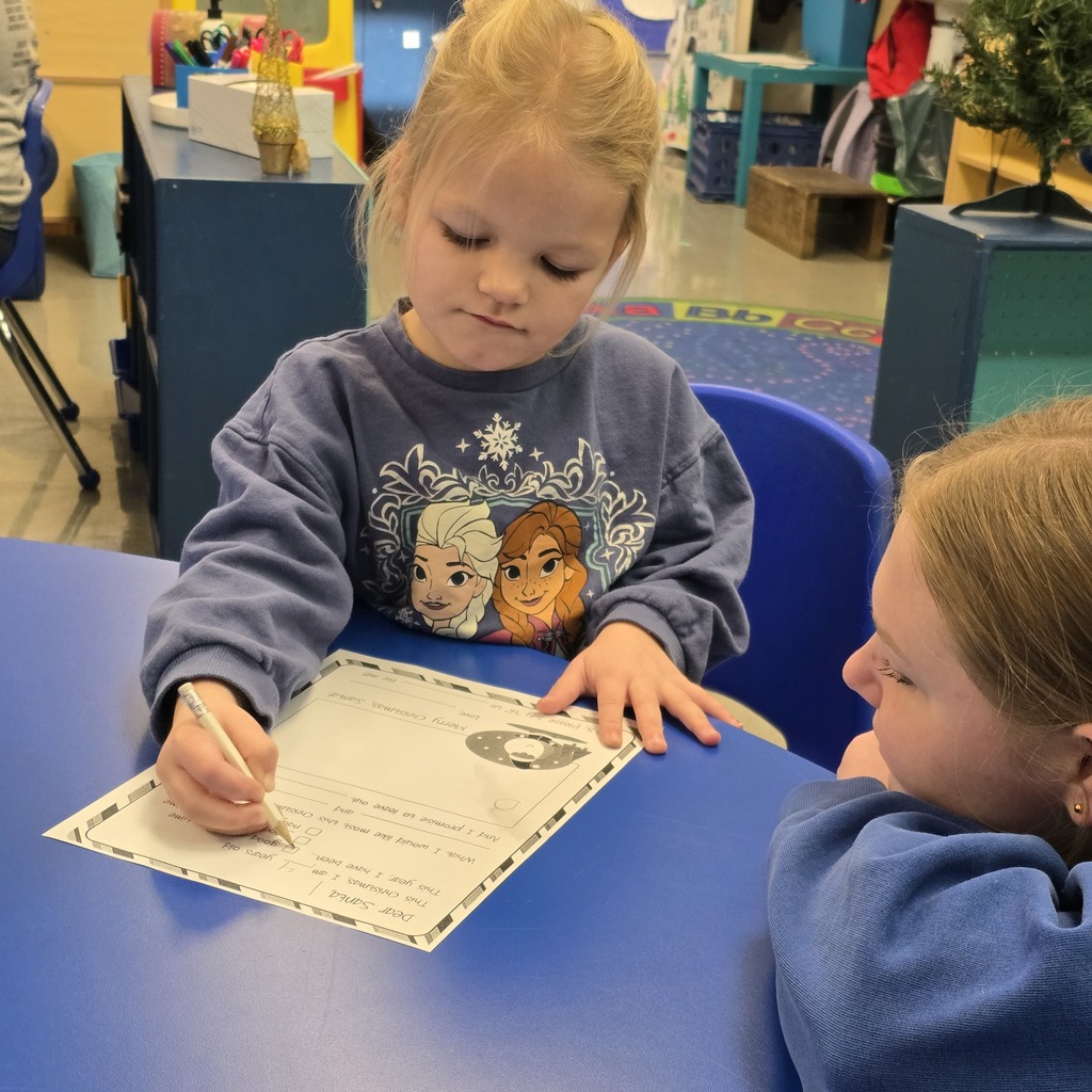 Senior Beta students help Tiger Cubs write Santa letters. 