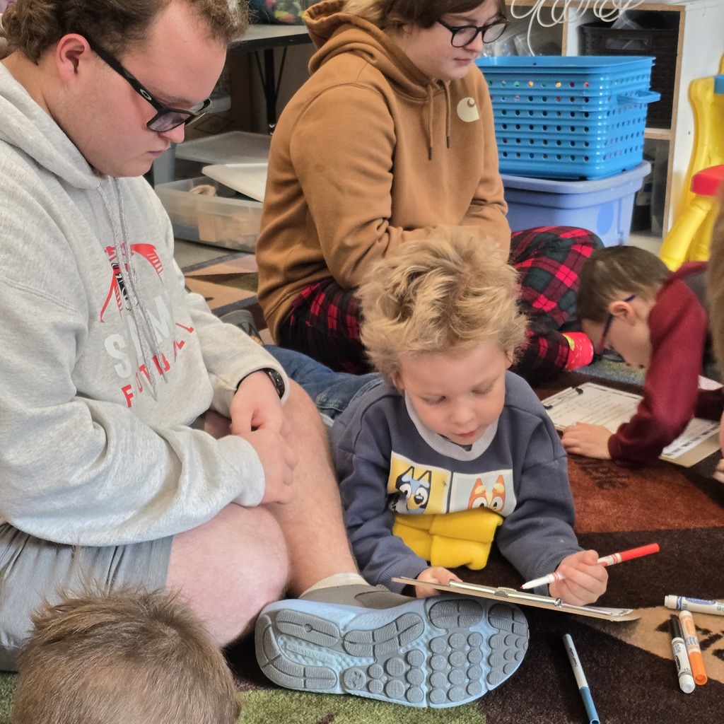 Senior Beta students help Tiger Cubs write Santa letters. 