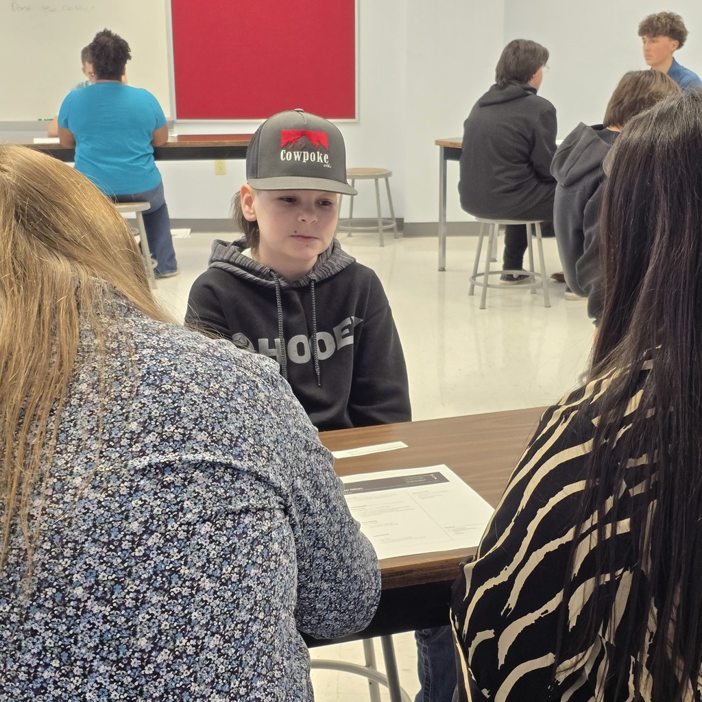 Middle school students work on interview skills with high school DECA and FBLA students!