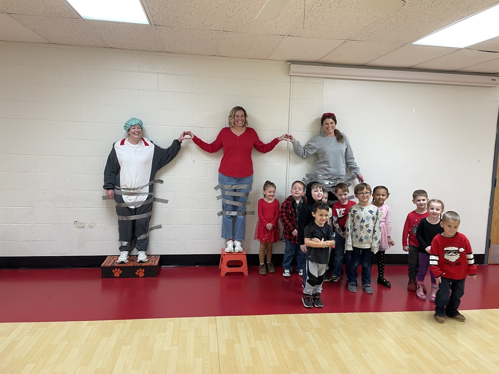 When Attendance Really Sticks! The principals were taped to the wall by students who had 93% attendance or higher.