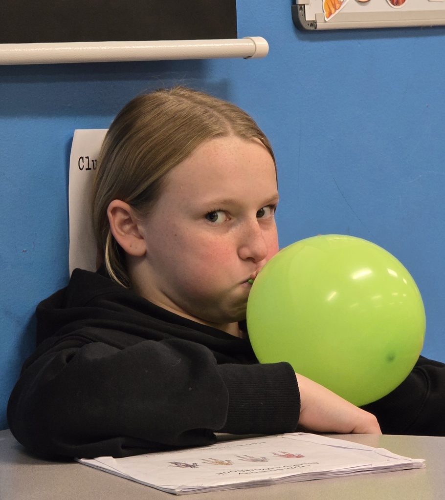 7th grade students learn about lung capacity in science class. 
