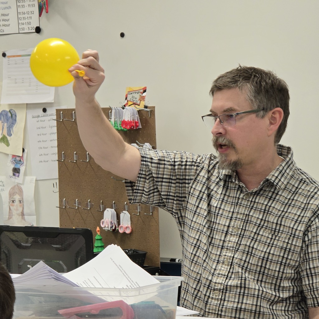 7th grade students learn about lung capacity in science class. 