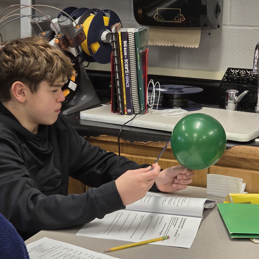 7th grade students learn about lung capacity in science class. 
