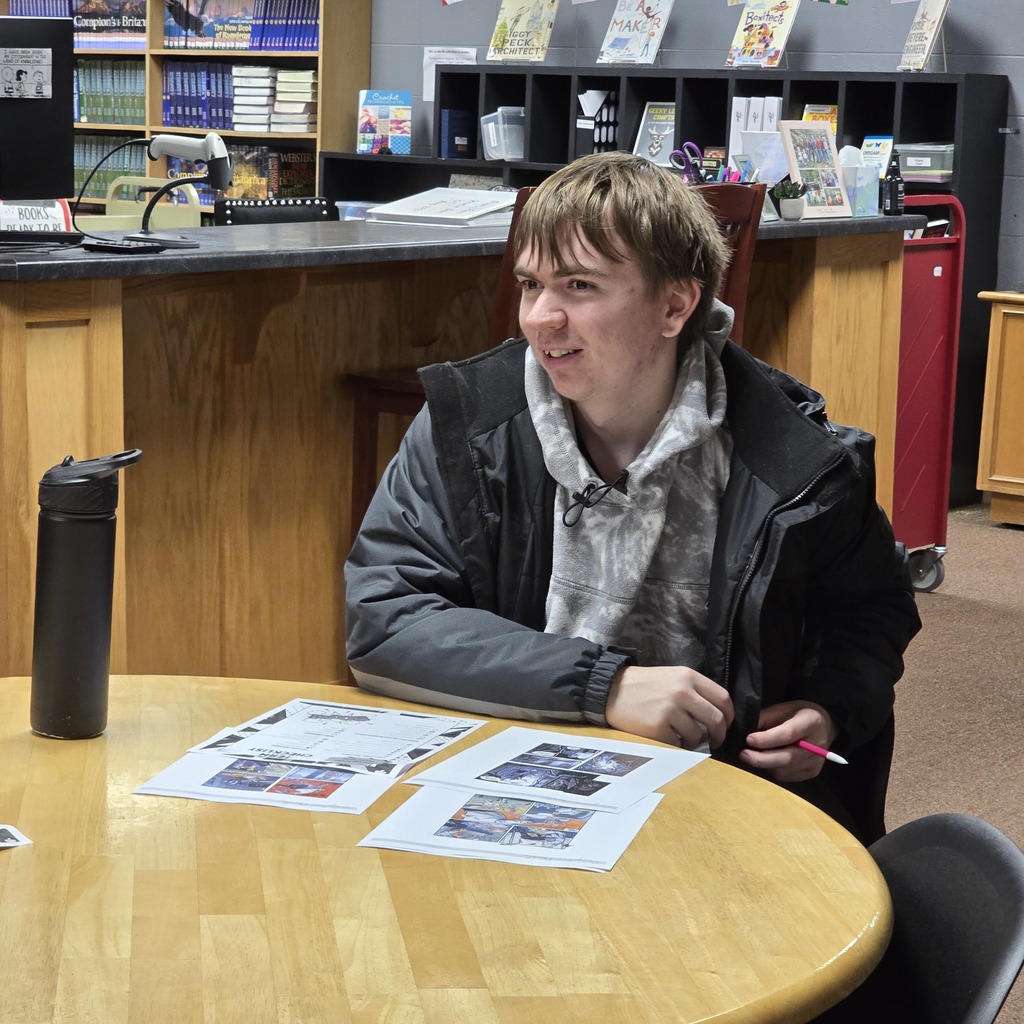 Mythology students learn about graphic novels in the high school library. 
