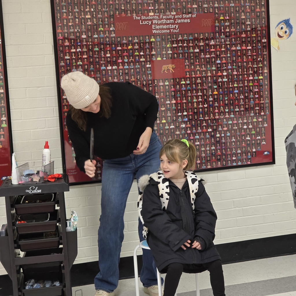Jumpstart Tigers volunteers fix students hair before school! 