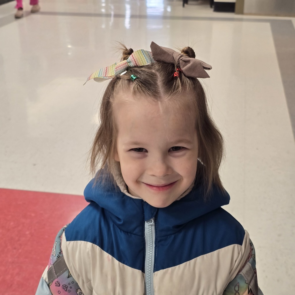 Jumpstart Tigers volunteers fix students hair before school! 