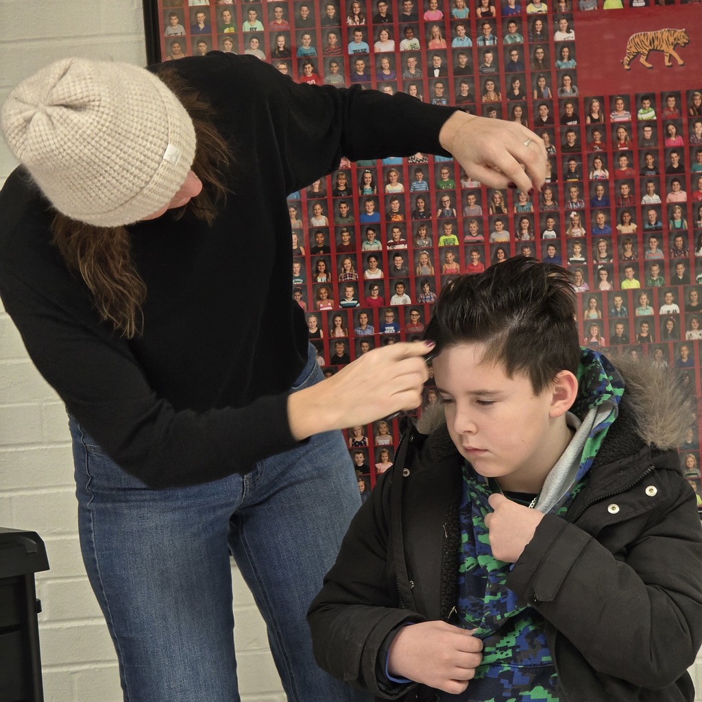 Jumpstart Tigers volunteers fix students hair before school! 