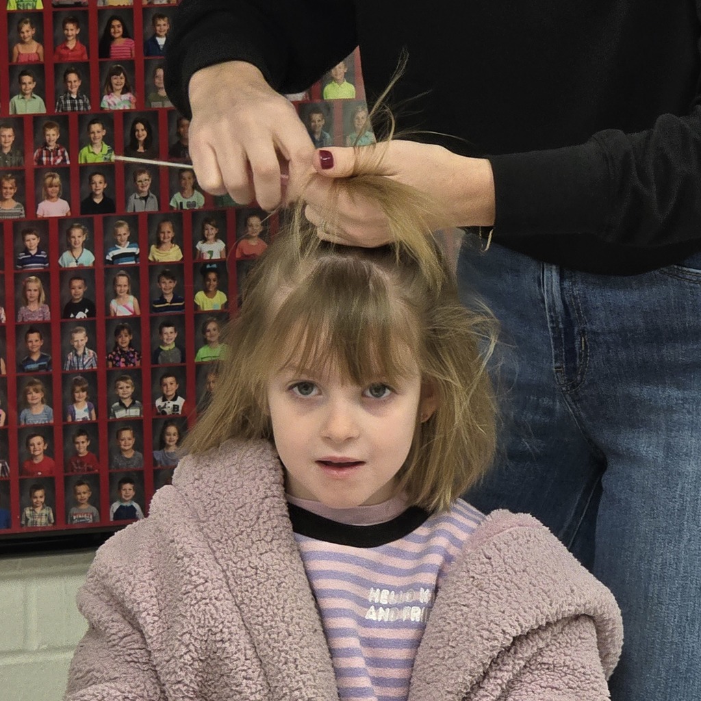Jumpstart Tigers volunteers fix students hair before school! 