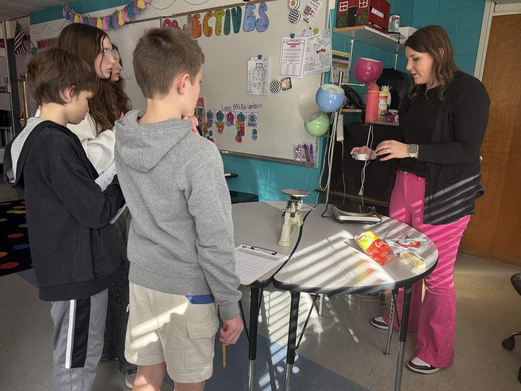 5th grade students test weight of materials in science.