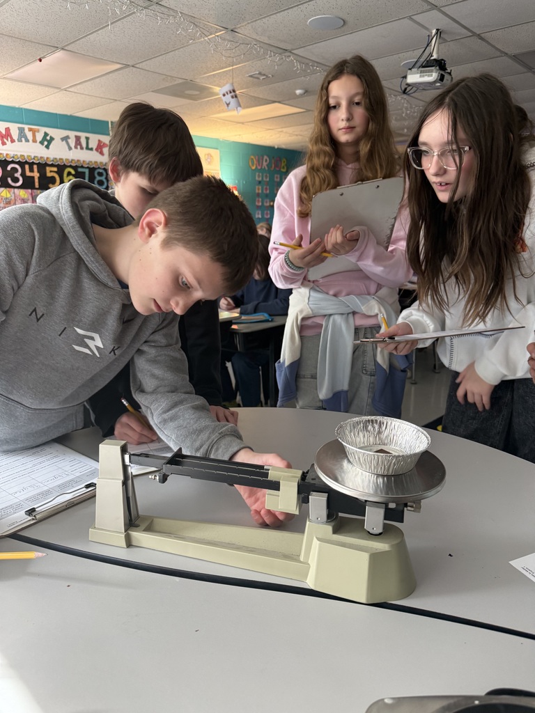5th grade students test weight of materials in science.