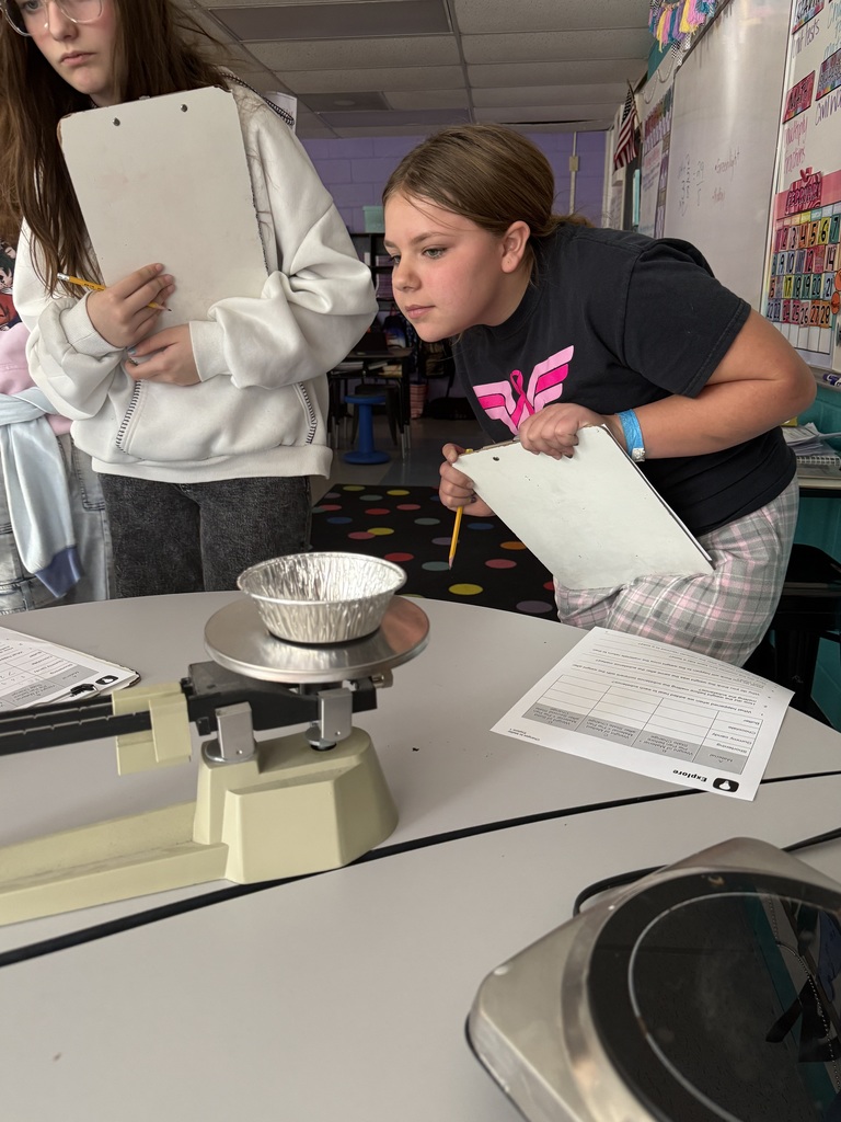 5th grade students test weight of materials in science.