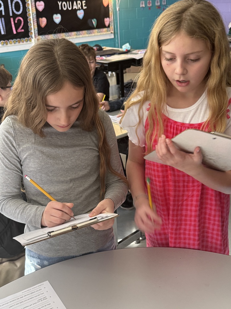 5th grade students test weight of materials in science.