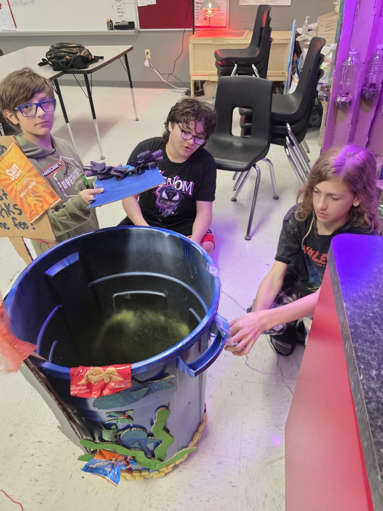 Students decorate trash can for MODOT competition. 