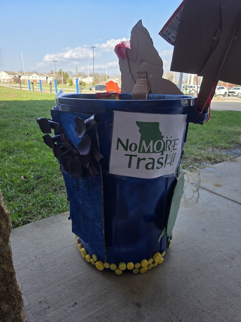 Students decorate trash can for MODOT competition. 