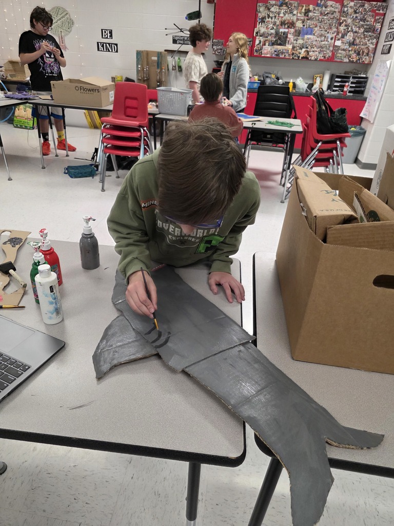 Students decorate trash can for MODOT competition. 