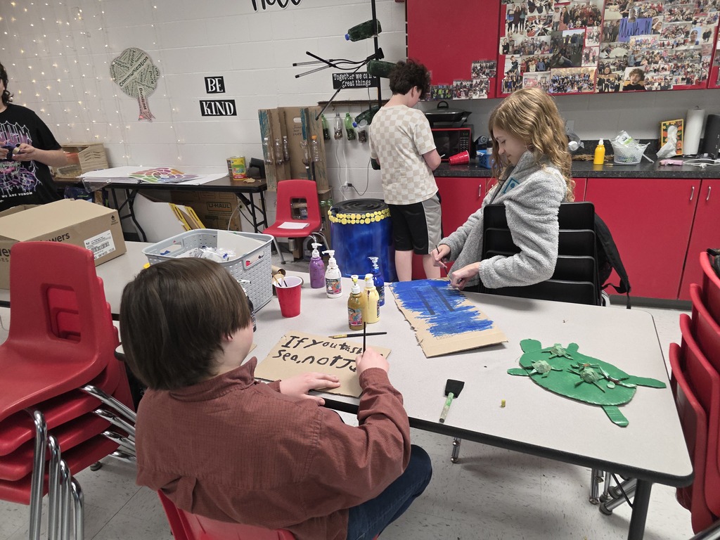 Students decorate trash can for MODOT competition. 