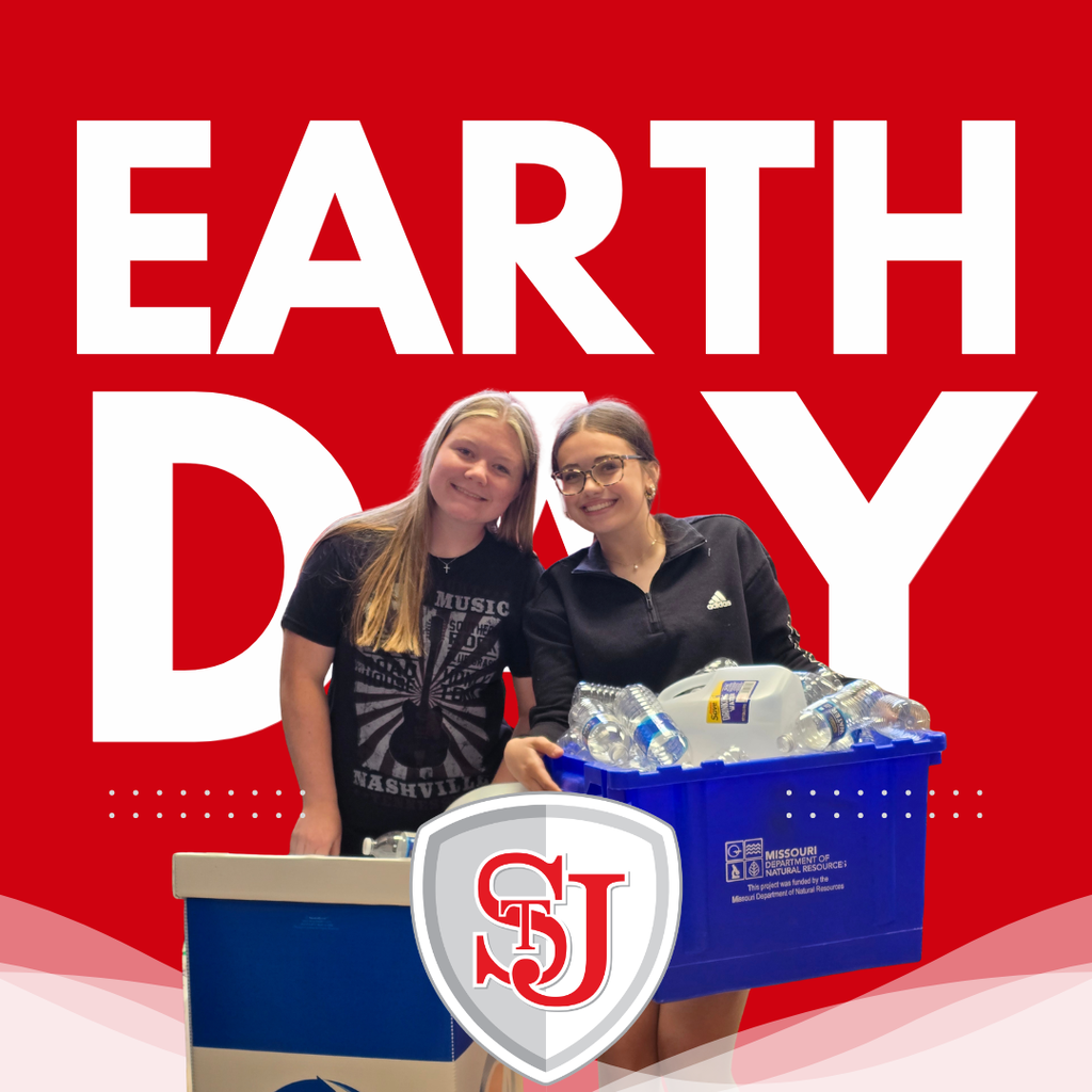 Two women stand behind a table with a blue crate of water bottles. They wear t-shirts. Text reads "EARTH DAY".
