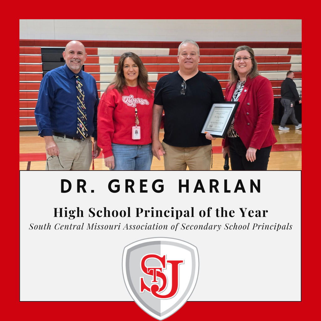 Four individuals stand on a basketball court. The two men wear light blue and black shirts. The two women wear red jackets. Text reads "DR. GREG HARLAN High School Principal of the Year."