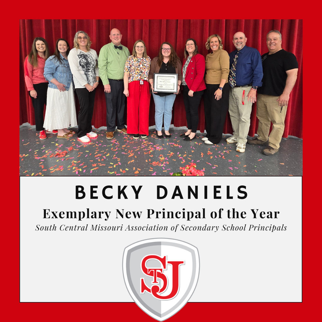 Eight adults, one holding an award, stand in front of a red curtain with confetti. "Becky Daniels" is written in bold.