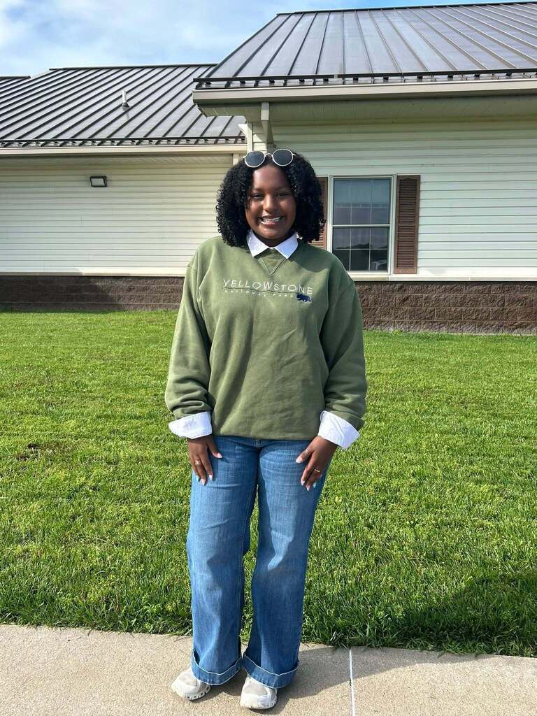 Student poses outside..